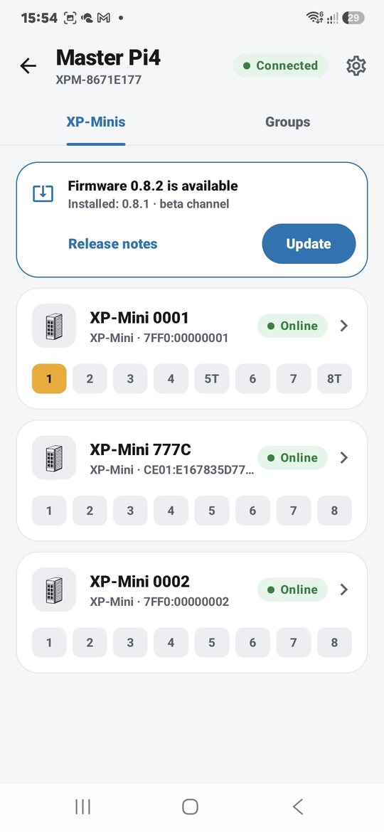 App screen showing XP-Minis and their ports, with a firmware update banner
